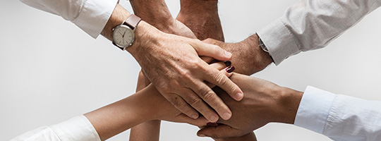 Hands meeting in center