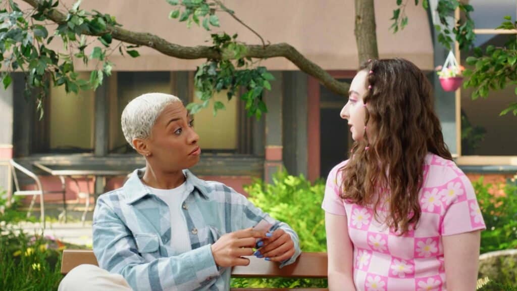 Two women talking about credit unions