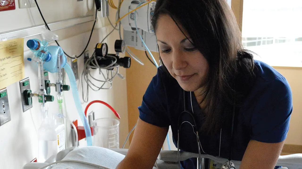 Michigan Medicine nurse assisting a patient