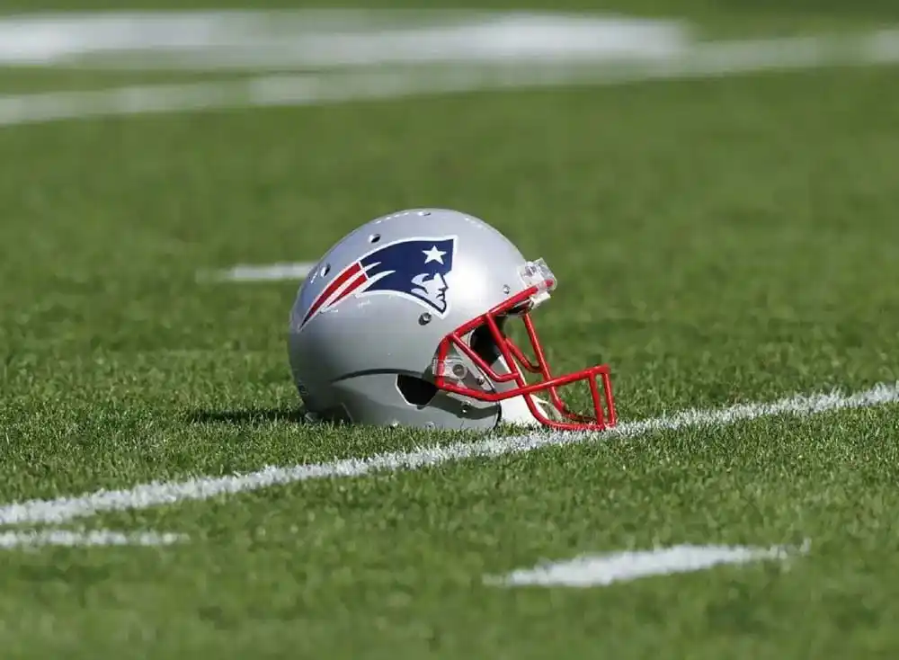 New England Patriots helmet on a football field