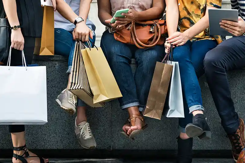 shoppers sitting together with their purchases